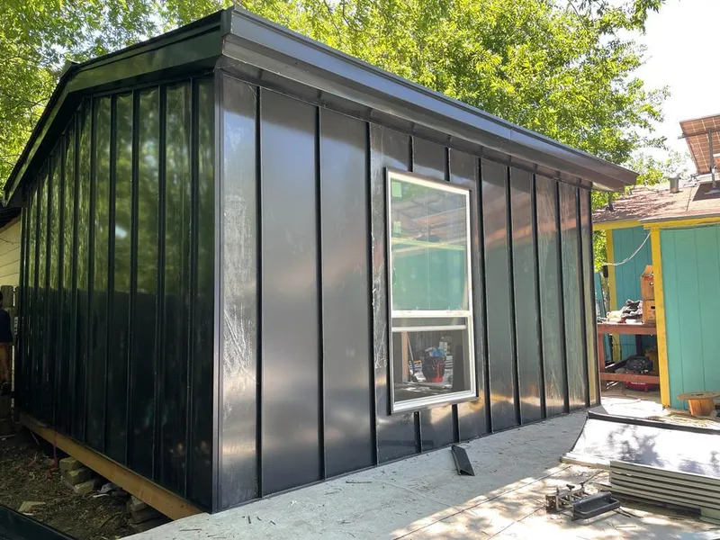 Black standing seam metal wall panels for Roof Inspection in Fulton